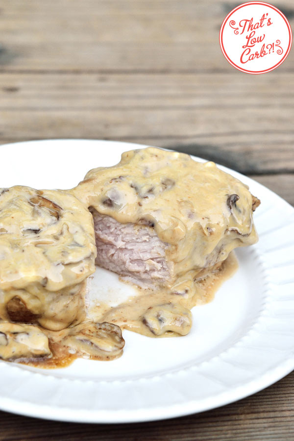 Low Carb Pork Chops Covered In a Creamy Cheese Sauce.