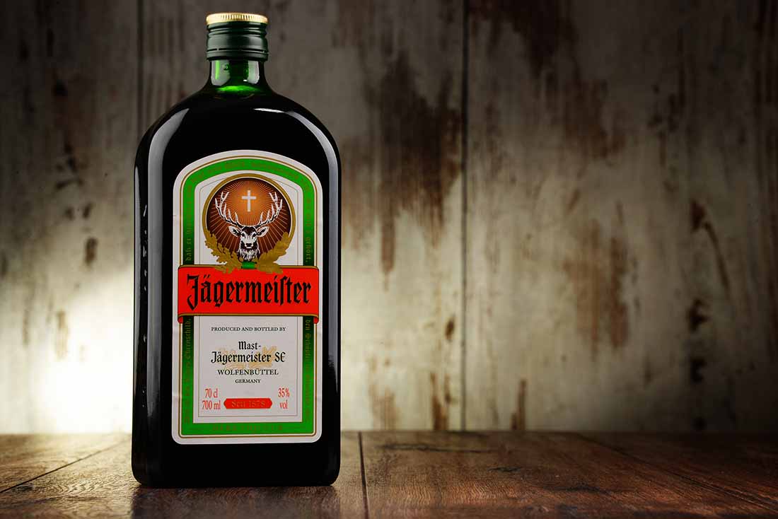 A Bottle of Jagermeister on a Wooden Surface.