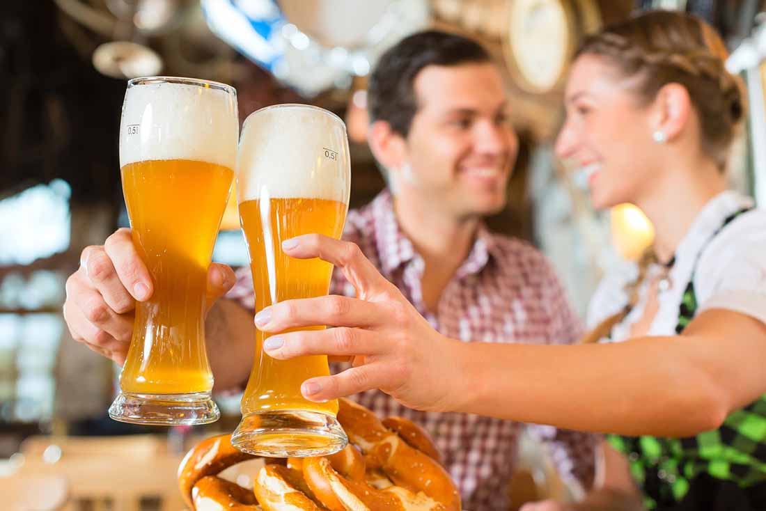 Two Adults Drinking Wheat Beer.