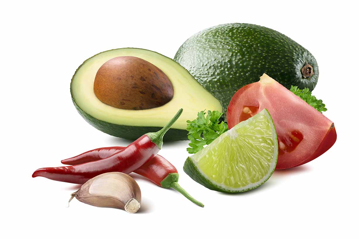 The Ingredients of Guacamole - Avocado, Tomato, Lime, Garlic.