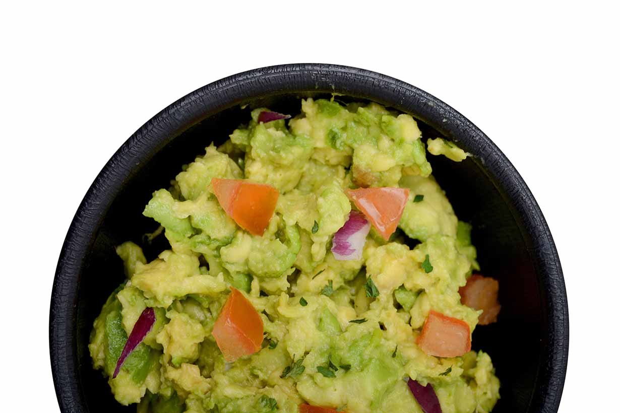 A Small Bowl Containing Guacamole.