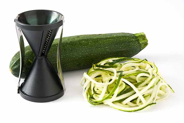 A Zucchini, Spiralizer, and Zoodles.