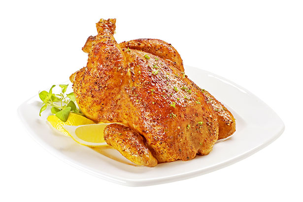 Picture of a Roast Chicken Seasoned With Lemon.