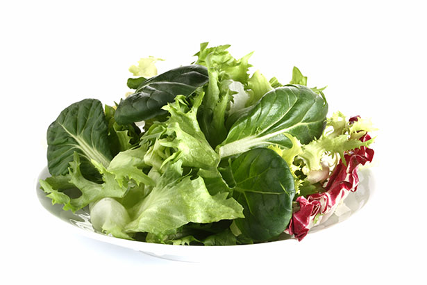 Leafy Green Vegetables In a White Bowl.