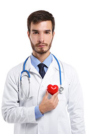 Picture of a Doctor Holding a Red Heart Shape.