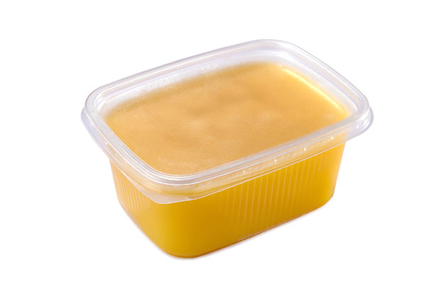 A Tub of Golden Colored Ghee.