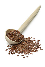 A Wooden Spoon Containing Flaxseeds.