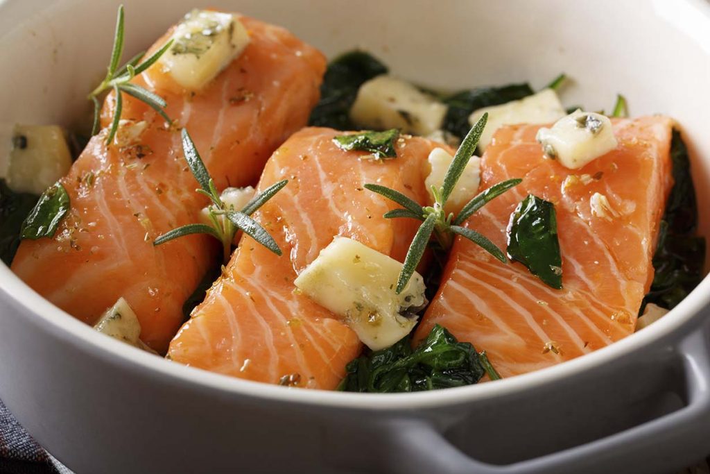 Picture showing how to cook salmon perfectly - lots of butter!