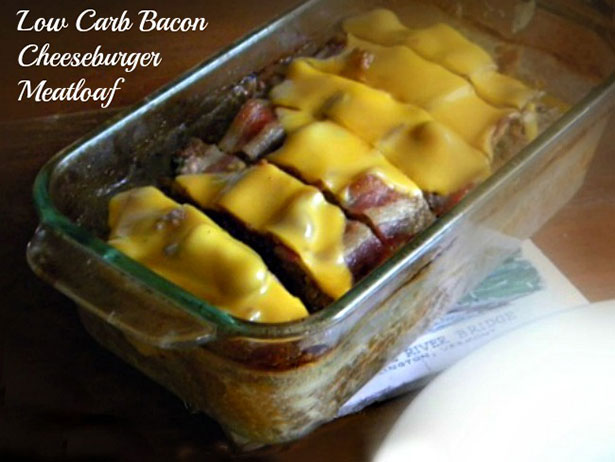 Picture of a meatloaf covered in bacon and cheese.