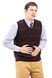 A Man With Stomach Pain Holding His Midsection.