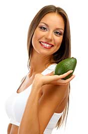 Picture of a Happy Woman Holding an Avocado.