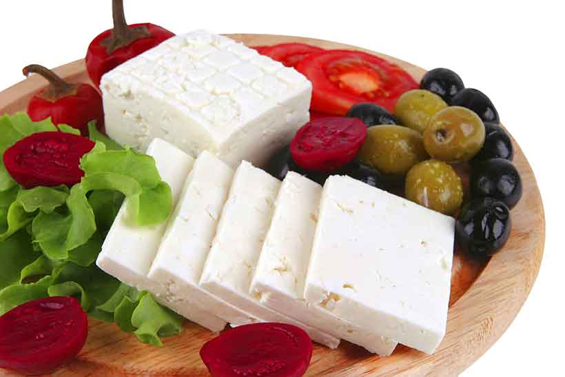 Feta Cheese On a Wooden Platter With Olives.