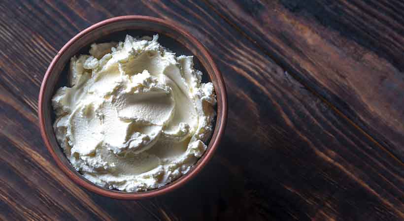 Italian Mascarpone Cream Cheese In a Brown Bowl.