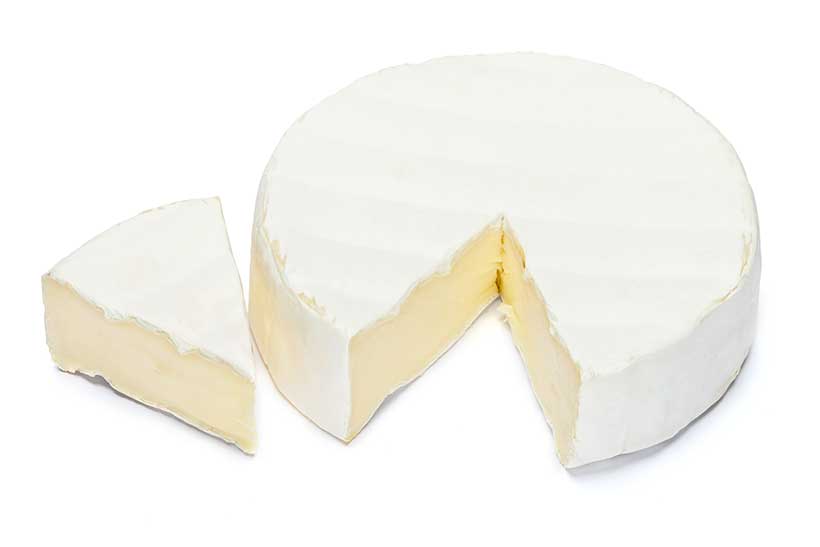 Round Portion of Brie Cheese Next To One Portion.