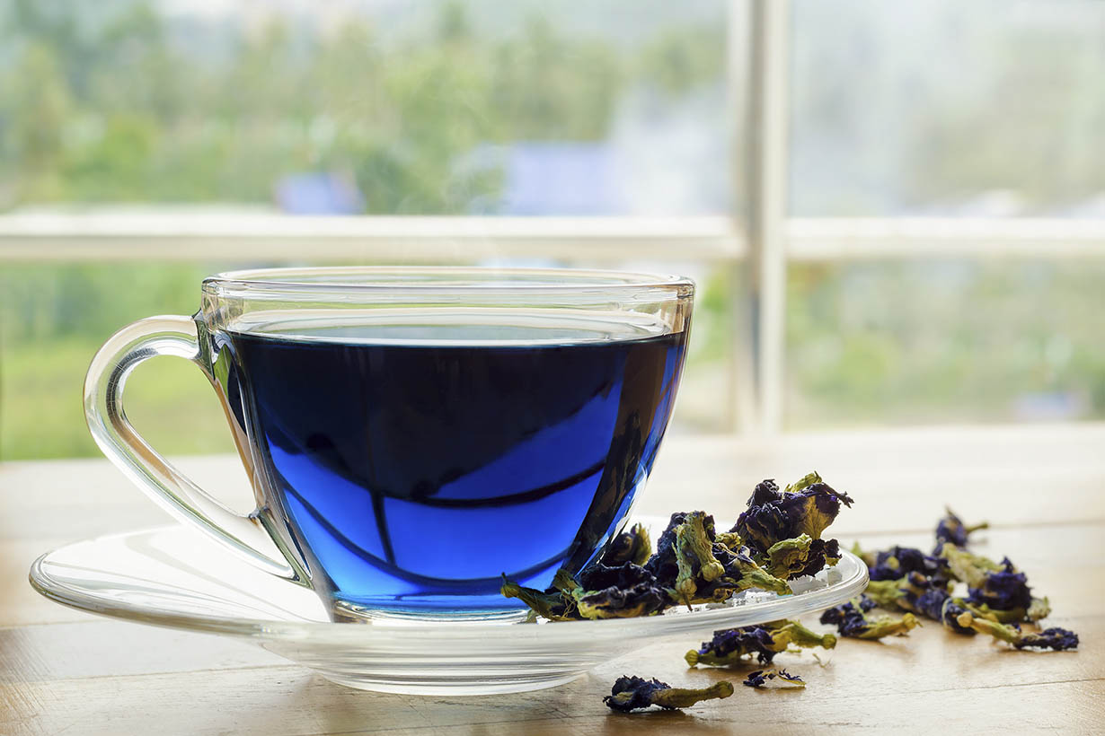 A Glass Cup of BlueChai Buttercup Flower Tea.