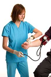 A Doctor Taking the Blood Pressure of a Lady.