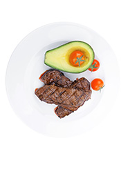 Picture of Steak, Half an Avocado and Cherry Tomatoes.