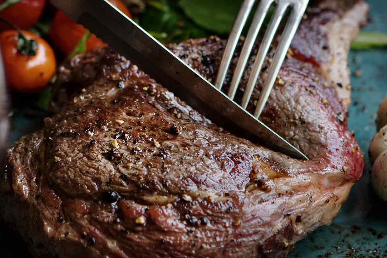 Picture of a Succulent Lamb Steak, and a Knife and Fork.