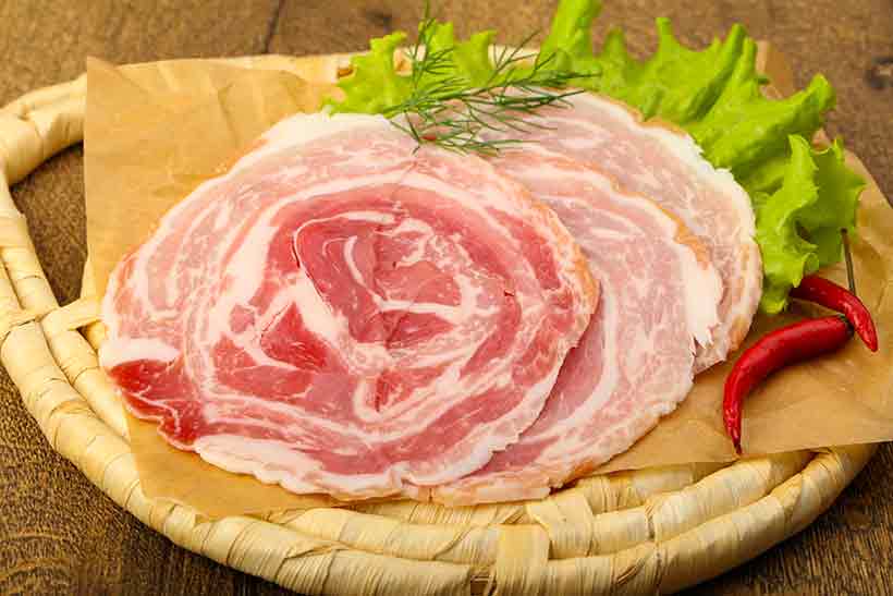 Slices of Pancetta Cured Meat.