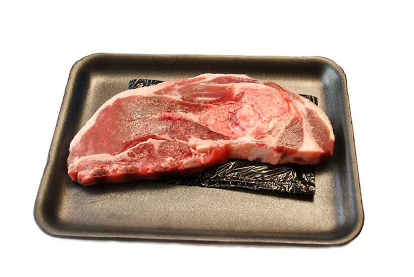 A Fatty Cut of Fresh Lamb Meat Steak On a Tray.