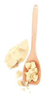 Picture of Cocoa Butter Chunks On a Wooden Spoon.