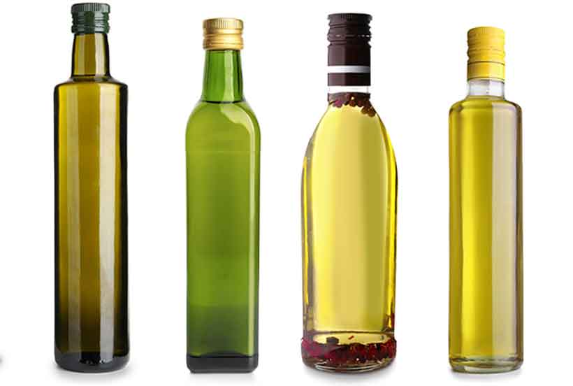 Bottles of Different Olive Oils: Extra Virgin vs Refined Olive Oils.