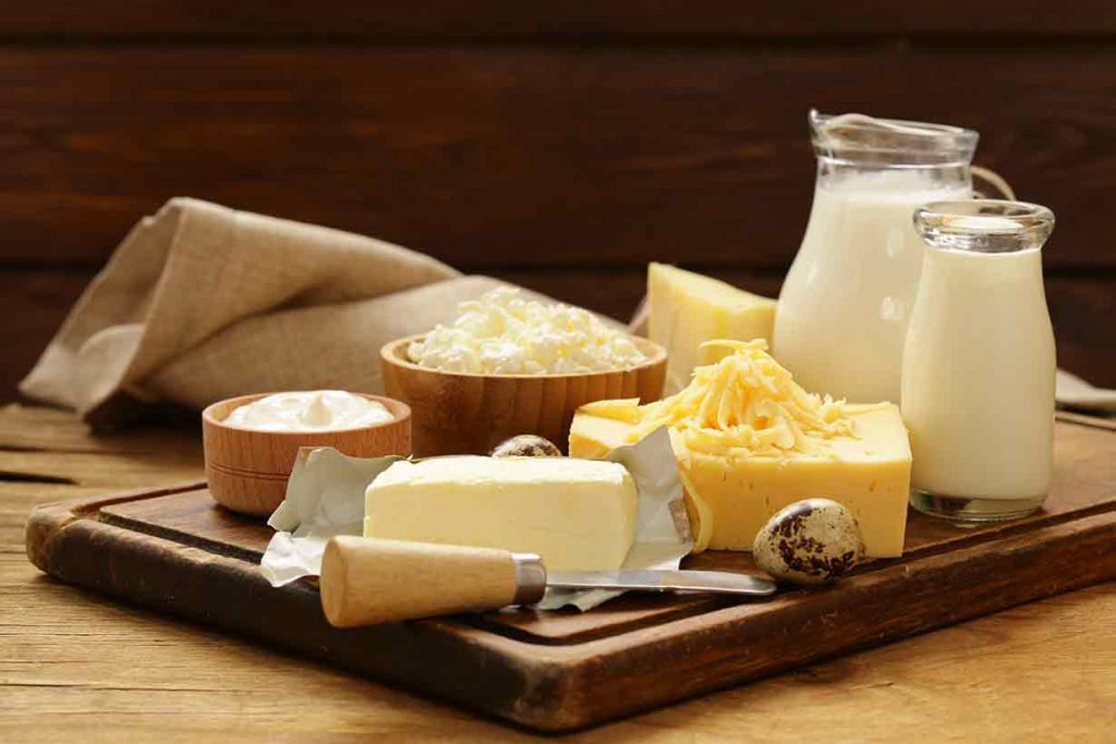 Various High-Fat Dairy Products On a Wooden Table.