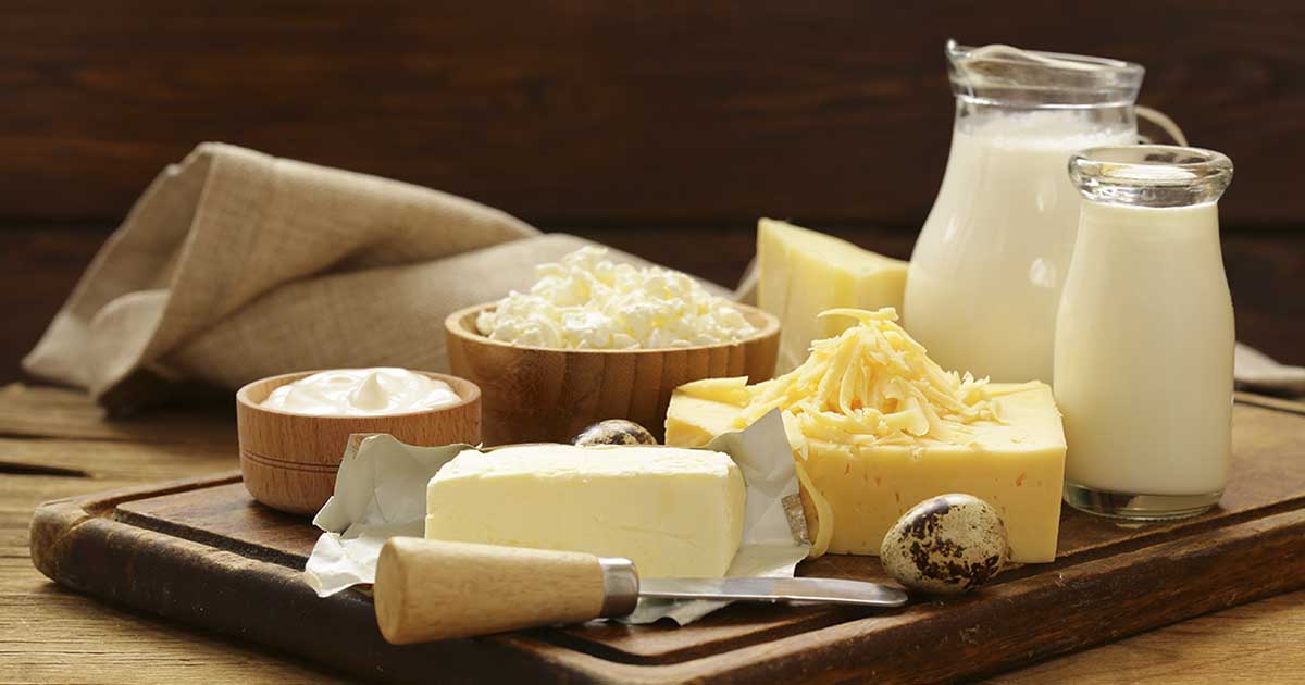 Various High-Fat Dairy Products On a Wooden Table.