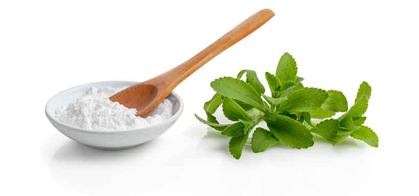 Stevia Leaves and Refined Stevia Powder In a Bowl.