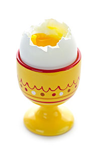 A Soft Boiled Egg In An Egg Cup With a Runny Yolk.