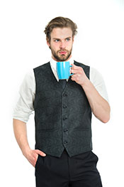 A Businessman Drinking a Cup of Black Tea, Looking Focused.