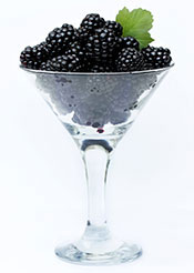 A Handful of Blackberries Served in a Glass.