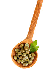 A Handful of Capers On a Wooden Spoon.