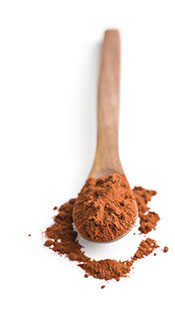 A Wooden Spoon Full of Cocoa Powder.