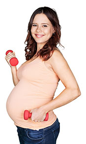 A Picture of a Pregnant Lady Holding Dumbbells.