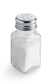 A Glass Salt Shaker With a Silver Lid.