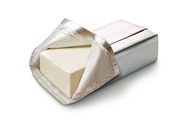 Bar of Cream Cheese In Foil Wrap Packaging.