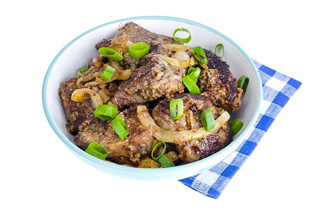 Bowl of Cooked Beef Liver With Onions.