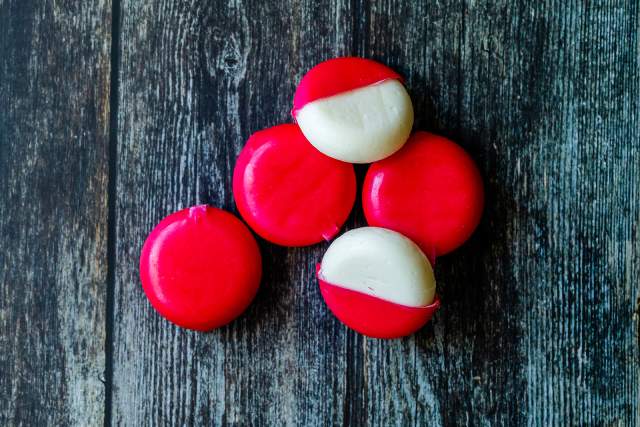 Five Single-Serve Portions of Babybel Cheese.