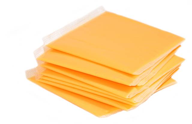 Slices of Processed American Cheese.