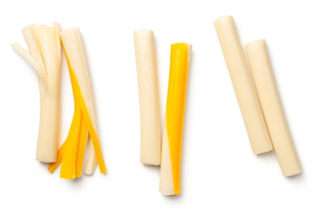 Cream and Orange Colored Sticks of String Cheese.