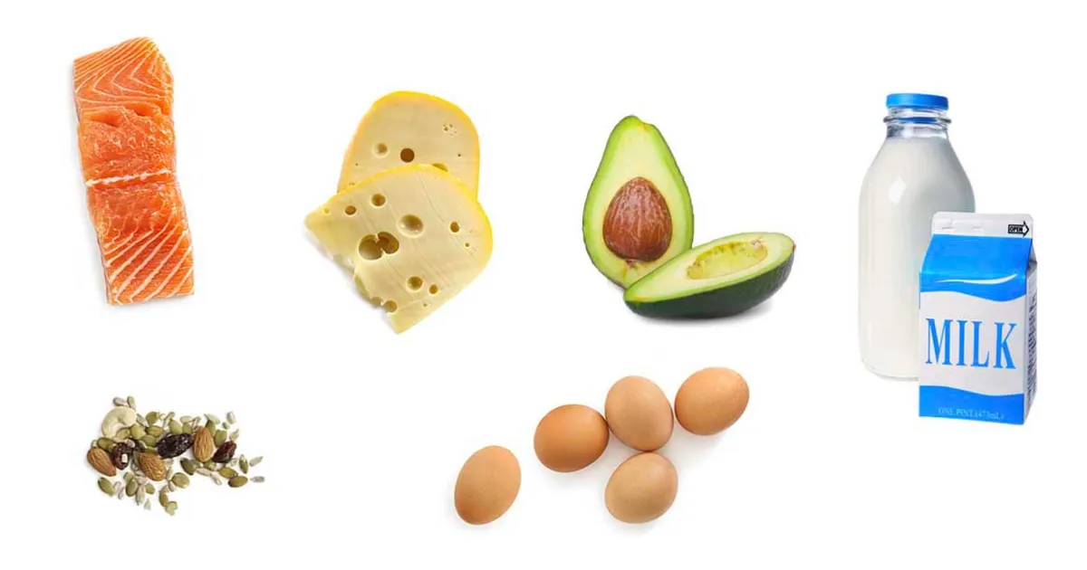 Several whole food sources of fat, including salmon, cheese, avocado, seeds, and milk.