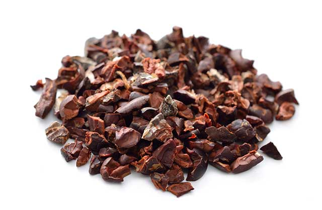 Cocoa Nibs On a White Background.