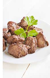 Cooked Chicken Livers On a White Plate.