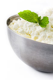 A Metal Bowl Containing Cottage Cheese.