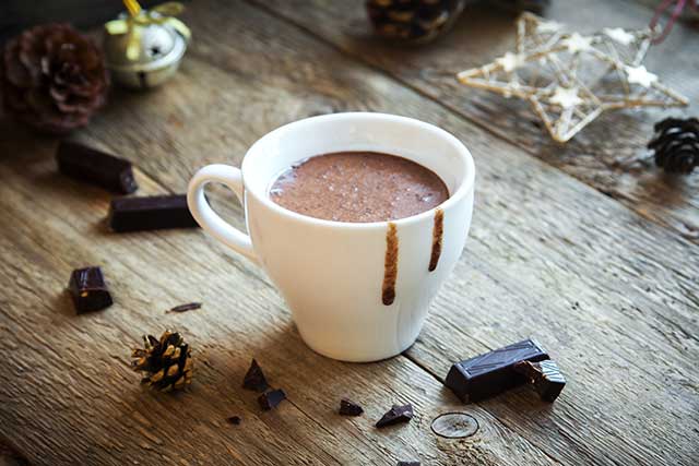 A Cup of Hot Chocolate (Cocoa) On a Wooden Table.