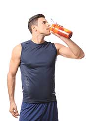 A Man Drinking a Protein Supplement From a Workout Flask.