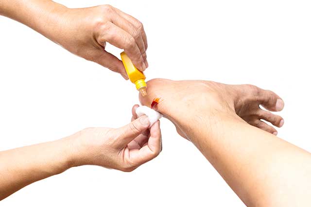 Using Bandaging On a Wound To Heal It.