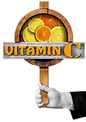A Sign Saying "Vitamin C" and Showing Oranges and Lemons.