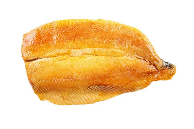 A Smoked Kipper Fillet On White Background.